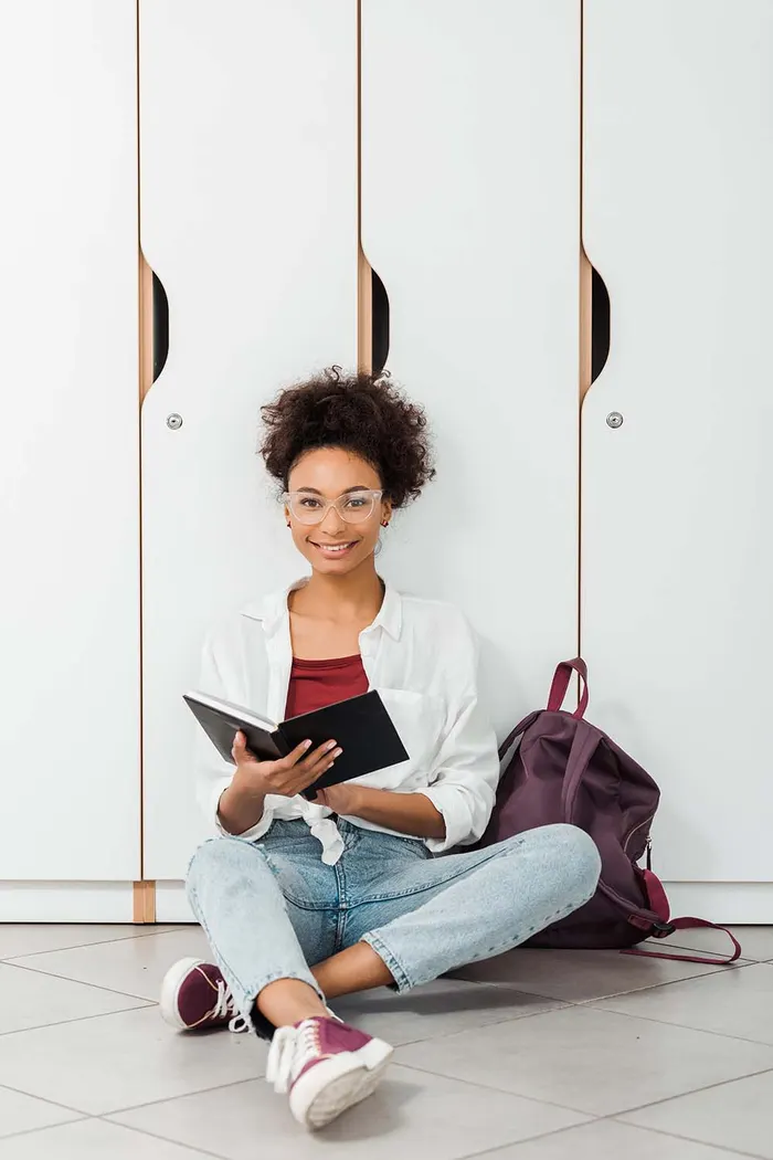 Learner with her study notebook